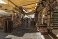 Sunshades, shops and alley Old Town Rhodes. Royalty Free Stock Photo